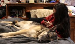 kailey with dog in bed