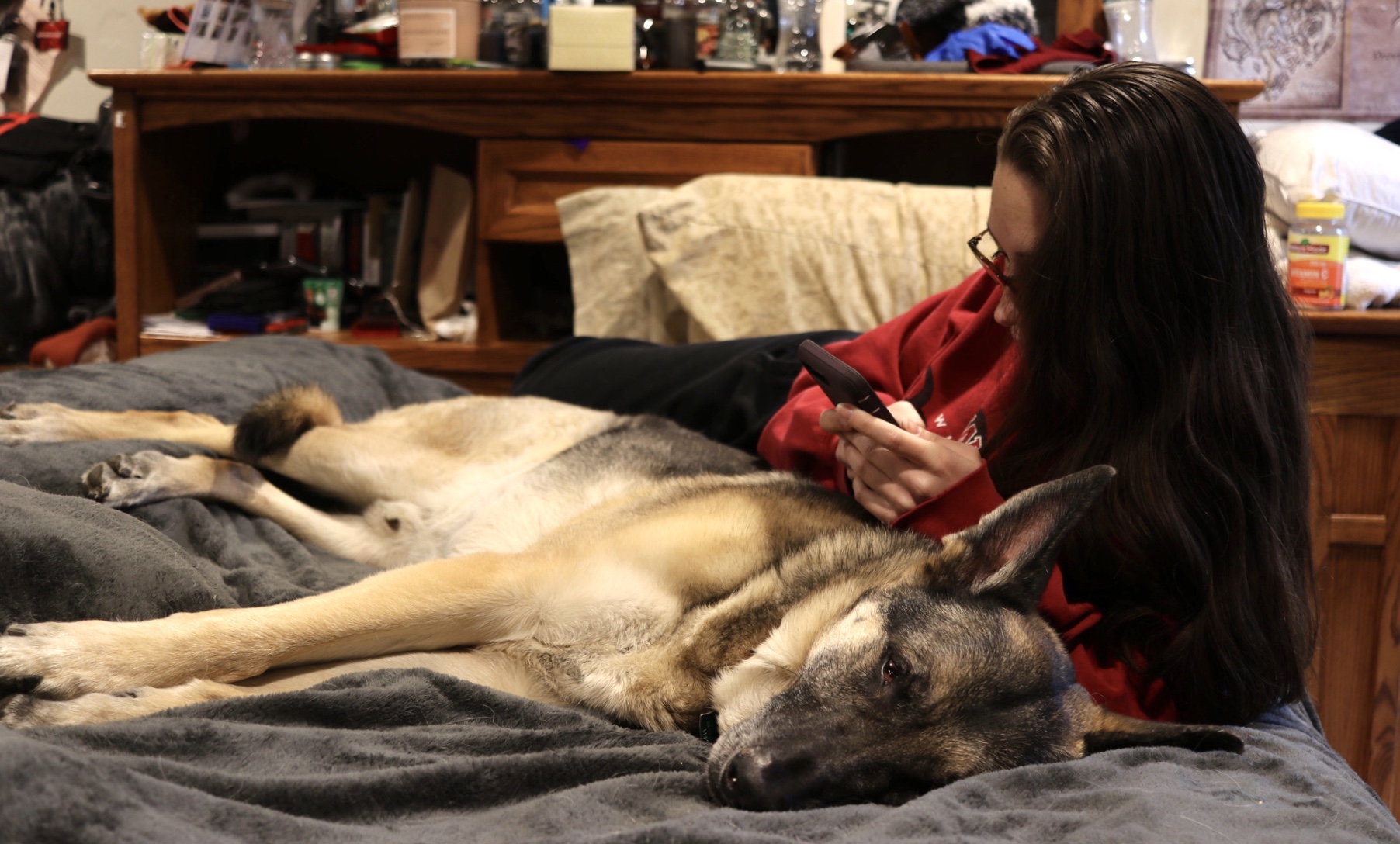 kailey with dog in bed